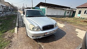 Другие автомобили: Седан серебристого цвета. Основные особенности: - Кузов: 4-дверный — 3