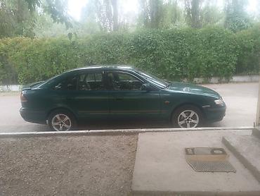 a8 d2: Mazda 626: 1997 г., 2 л, Механика, Бензин, Седан — 5