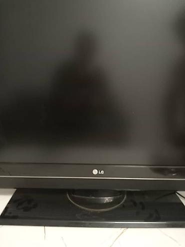 ТВ и видео: Черный плоский телевизор LG с широким экраном и матовой поверхностью — 2