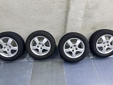 r15 100 4: Комплект из 4 колес в сборе: литые диски + шины. - Диски — 3