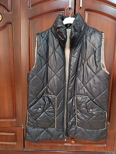 heri bezekleri: Qadın üçün yastı tikişli, qara rəngli quilted jilet. - Material — 2