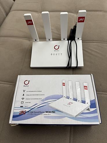 Модемы и сетевое оборудование: Маршрутизатор OLAX 4G High Speed Router MC50 PRO Ключевые — 1