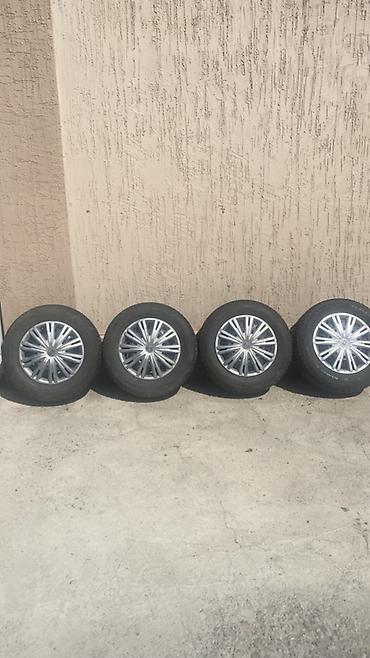 tir: Комплект из 4 зимних колес в сборе: шины + оригинальные колпаки VW. - — 1