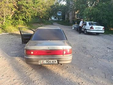 Транспорт: Mazda 323: 1990 г., Седан — 1
