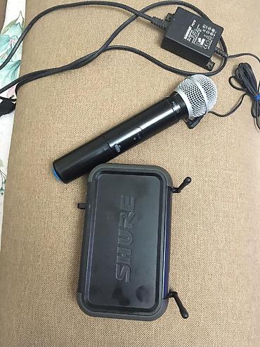 mikrofon tutucu: Shure pgx24/sm58 original.Mikrofon ella isleyir.yeni deyə — 2