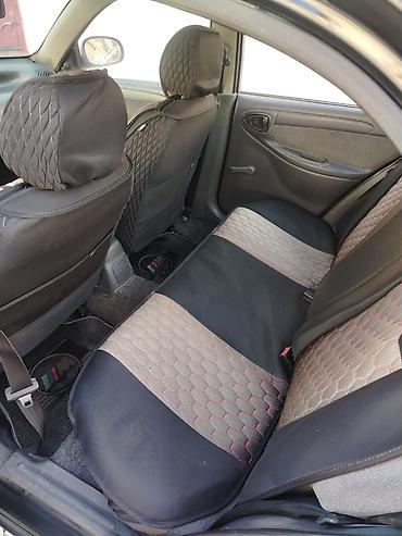 Daewoo: Daewoo Nexia: 1.3 l | 2010 il Sedan — 4