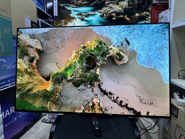 Телевизоры: Телевизор TCL 50V6B, LED, черный Описание Используйте голос для — 13