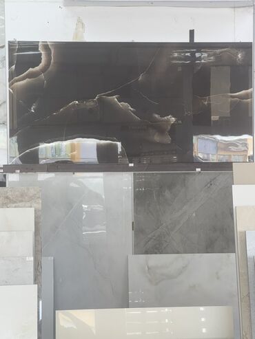 gəc nədir: Tünd boz rəngdə, mərmər naxışlı keramik plitə. Bu plitə parlaq səthə