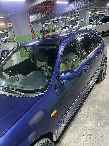 familia: Mazda Familia: 2000 г., Механика, Бензин, Хэтчбэк — 5