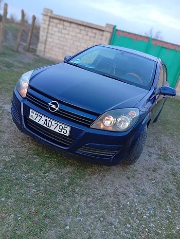 Opel: Opel Astra H, göy rəng, heçbek kuzov. Texniki xüsusiyyətlər: - Ön — 2