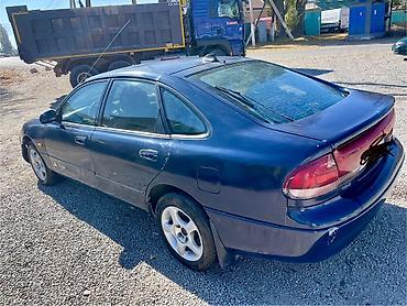 ом 422: Mazda Cronos: 1994 г., Седан — 3