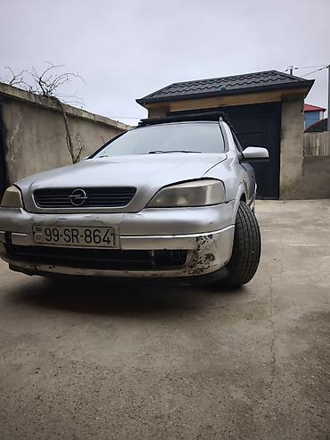 Opel: Opel Astra Caravan (universal) – gümüş rəngli kuzov, 5 qapı, dam — 6
