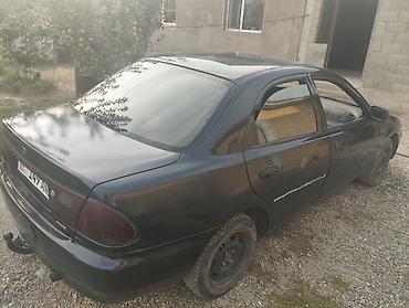 Унаа сатуу: Mazda 323: 1996 г., 1.8 л, Кол менен иштөөчү, Бензин, Седан — 4