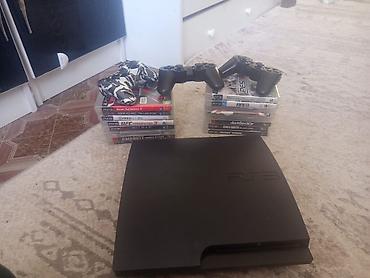 PS3 (Sony PlayStation 3): Игровая консоль Sony PlayStation 3 (модель Slim) с набором дисков — 14