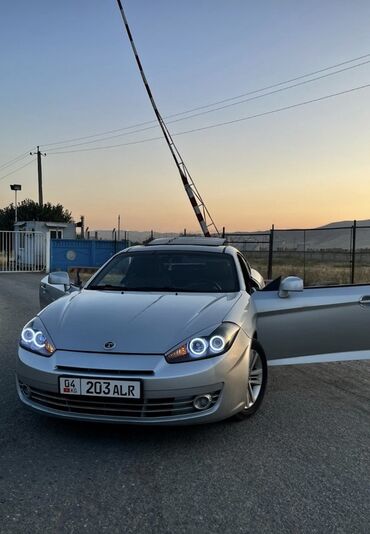 грузовой автомобиль: Купе Hyundai Tiburon (Coupe) — серебристый цвет кузова. Особенности и