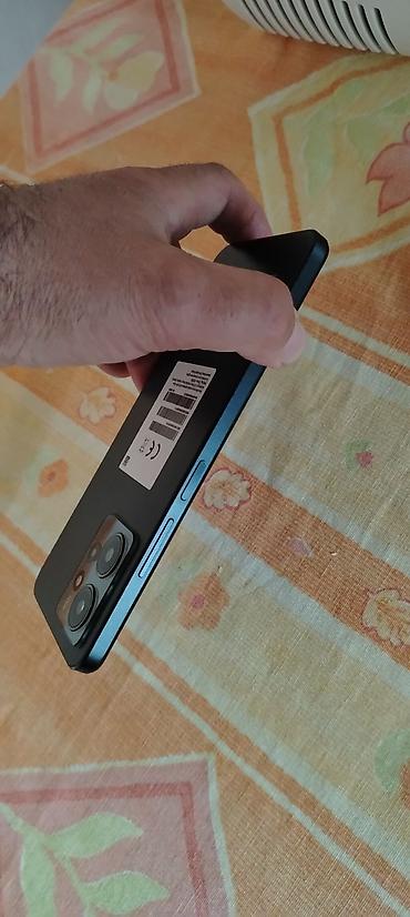 Redmi: Xiaomi Redmi Note 12 (görsellərdə) - Ekran: 6.67" AMOLED, mərkəzi — 7