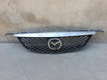 железные решетки: Решётка радиатора Mazda примаси 1999 года выпуска (BK) — 1