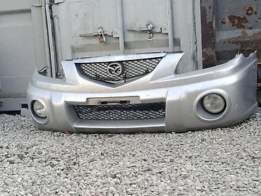 Передний бампер Mazda Примасси 2003 год (серебристый), с комплектом
