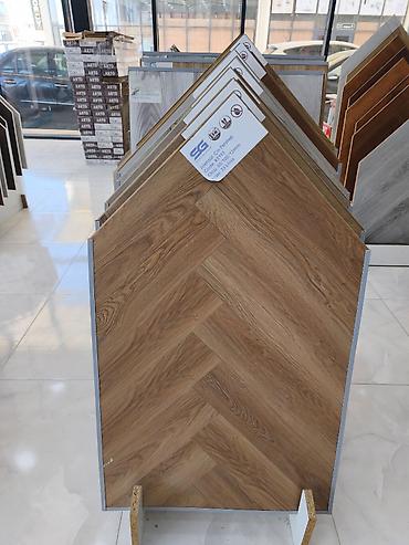 Herringbone naxışlı döşəmə örtüyü – taxta fakturalı laminat panellər at lalafo.az Herringbone naxışlı döşəmə örtüyü – taxta fakturalı laminat panellər