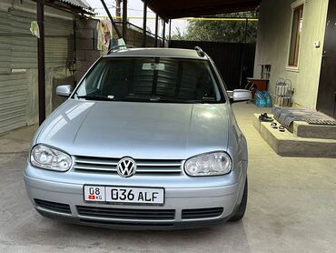 обе стороны: Volkswagen Golf: 2001 г., 2 л, Автомат, Бензин, Универсал