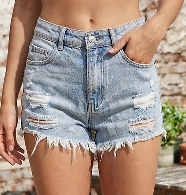 obim kukova: Ženske teksas šorts hlače – svetlo ispran denim sa „distressed” — 1