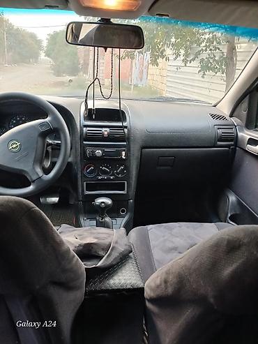 Opel Astra Caravan (universal), mavi rəng. - Kuzov: universal, dam