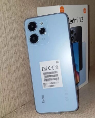 хиоми телефон: Redmi, Redmi 12, Б/у, 128 ГБ, цвет - Голубой, 1 SIM, 2 SIM