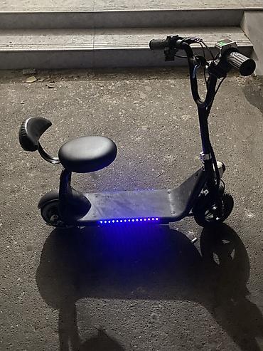 Электротранспорт: Oturacaqlı elektrik skuter -saatda 20 km surerle hereket edir — 1