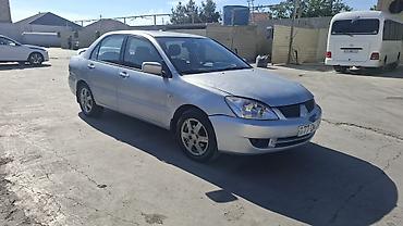 duman fara: Mitsubishi Lancer: 1.6 l | 2006 il 466000 km Sedan — 2