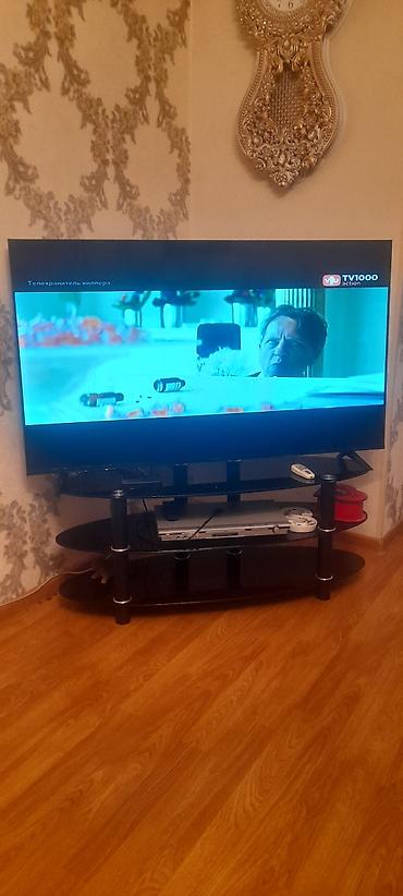 xarici hard disk satilir: LED televizor və TV stendi dəsti - Ekran ölçüsü təxminən 55–60 düym — 1
