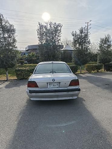 bmw f10 lip: BMW 7 Series sedan (E38), gümüş rəngli, 4 qapılı, arxa ötürücülü — 6