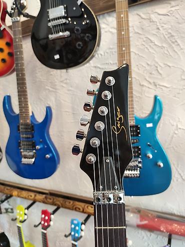 gitara akustik: Elektro-gitara Model:Smiger L-G8 Simlərin sayı: 6 Üst:Deadwood — 2