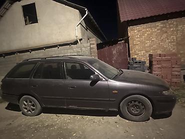 аудио касета: Mazda 626: 1997 г., 1.8 л, Механика, Бензин, Универсал — 1