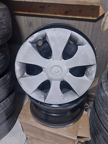 avtomobil cadiri: Chevrolet loqolu orijinal təkər qapaqları ilə birlikdə dəmir disk — 2