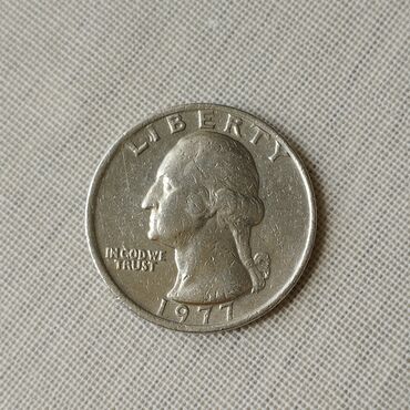 Sikkələr: 1977 ilin Quarted Dollar 25 sent. Material mis-nikel ərintisi. Qəpiyin