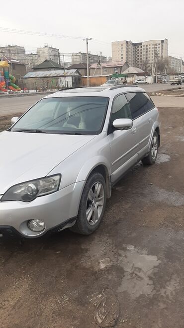 сюрф сурф: Универсал Subaru Outback серебристого цвета, оснащенный люком на крыше