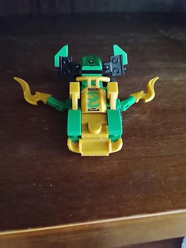 kinder surprise oyuncaqlari: LEGO mini model – yaşıl/sarı temalı kiçik hover/skuter tipli quruluş — 1