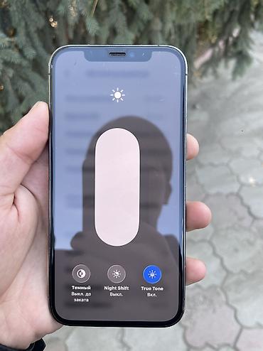 солнечная камера видеонаблюдения: IPhone 12 Pro, 128 ГБ. Смартфон Apple в тёмном цвете с корпусом — 2