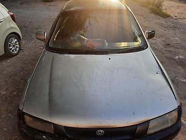 Транспорт: Mazda 323: 1997 г., 1.6 л, Автомат, Бензин — 2