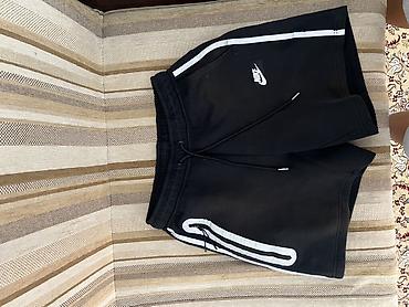 Спортивные шорты Nike, черные - Классический крой до колена -