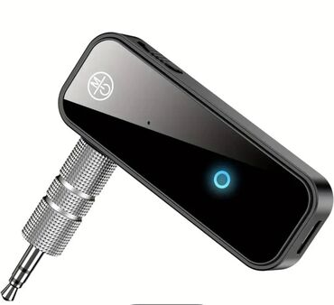 штекер магнитола: Bluetooth-адаптер черного цвета, предназначенный для подключения к