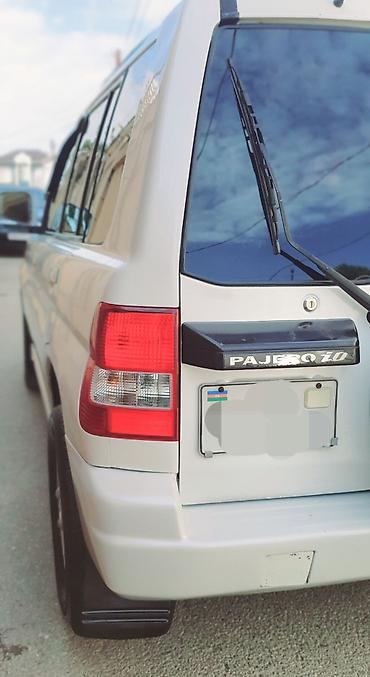 pajero tekeri: Mitsubishi Pajero iO 4WD – ağ rəngli, kompakt off-road SUV Maşına — 7