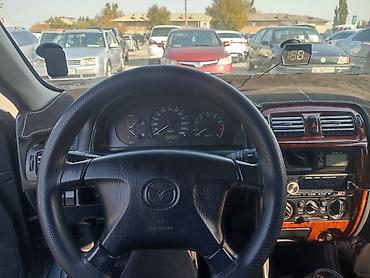 мотор на мопед: Mazda 626: 1999 г., 1.8 л, Механика, Бензин, Седан — 5