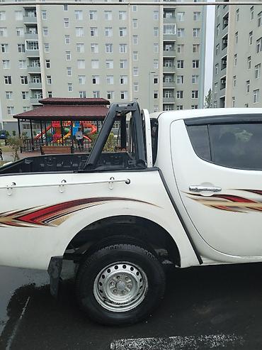 235 55 18: Mitsubishi L200: 2.4 l | 2008 il 302118 km Pikap — 10