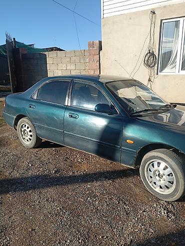 kia spektra: Mazda 323: 1993 г., Седан — 3