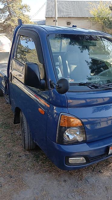 хд 72: Hyundai Porter II, синий бортовой малотоннажный грузовик. Особенности — 1