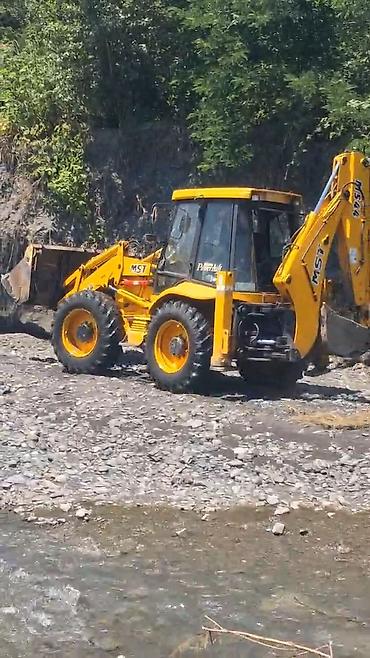 byd şarj cihazı: MST backhoe-loader (ekskavator-yükləyici) - Marka/model: MST (Auto — 2