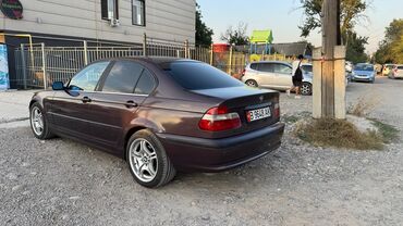 купить двигатель бмв х5 дизель: Седан BMW 3 серии темно-коричневого цвета, оснащенный черными