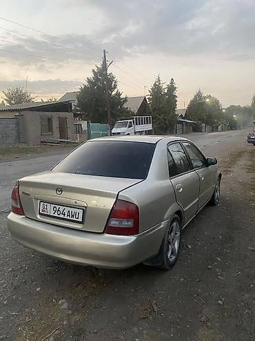 машина daihatsu: Mazda 323: 2001 г., 1.5 л, Автомат, Газ, Седан — 3