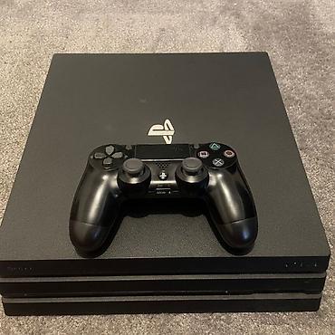 tracker gps: Sony PlayStation 4 Pro (черная) - Консоль PS4 Pro с логотипом — 1